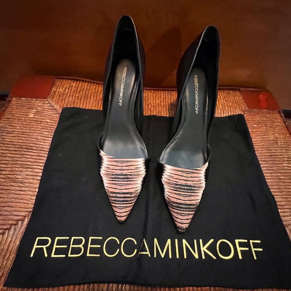 Leather D’Orsay Tiger print pumps.